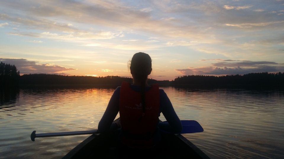 Canoe on the lake at sunset